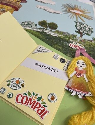 Pormenor da capa, com destaque para o <br/>livro que a integra e para a personagem, Rapunzel.
